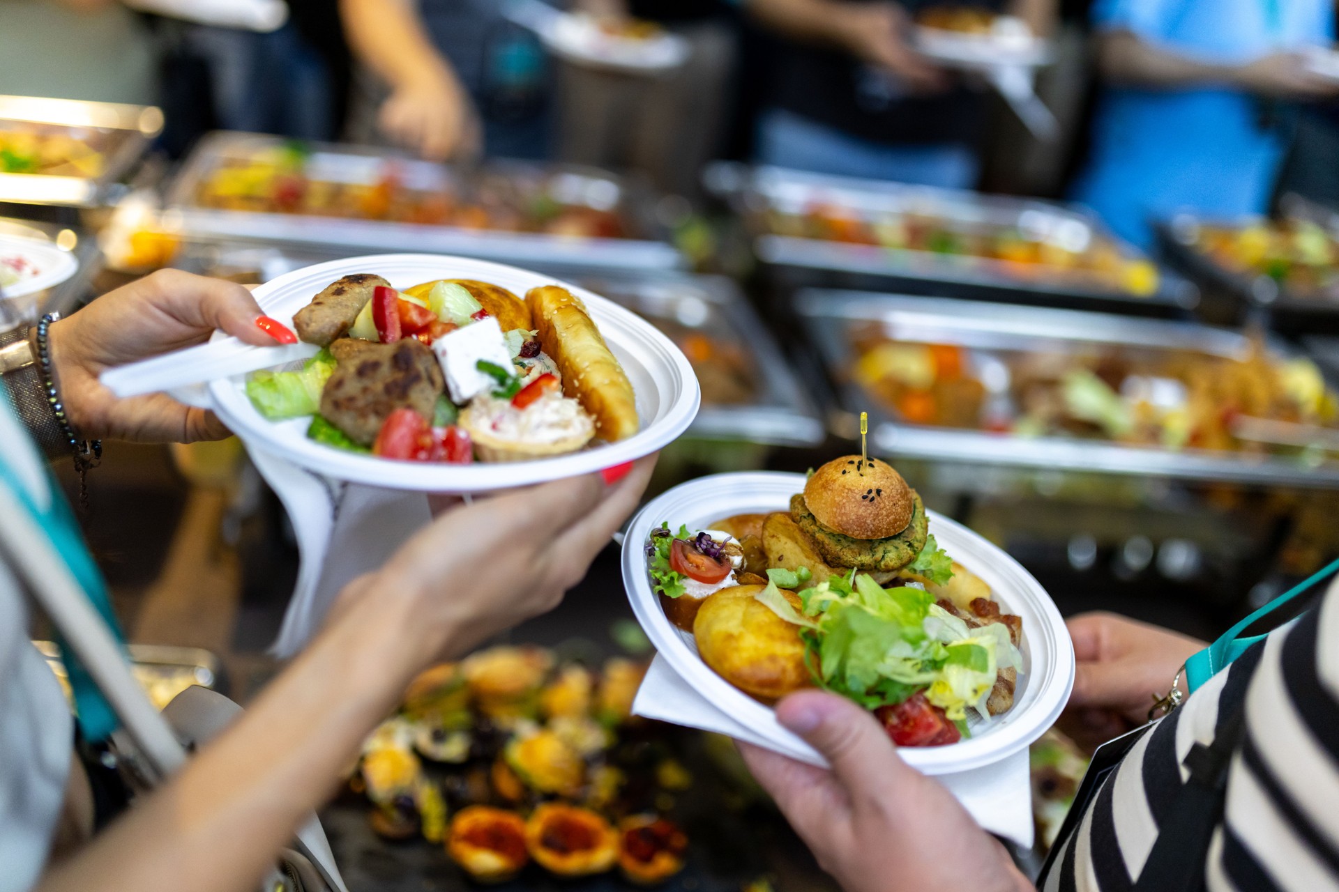 Guests enjoying delicious buffet meals during a lively food festival celebration event
